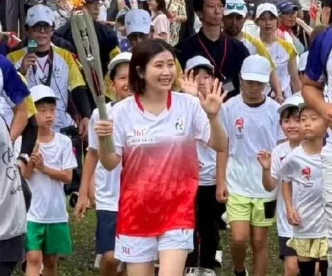 Ai Fukuhara, now with the man from her alleged affair, appears at the Asian Games to carry the torch